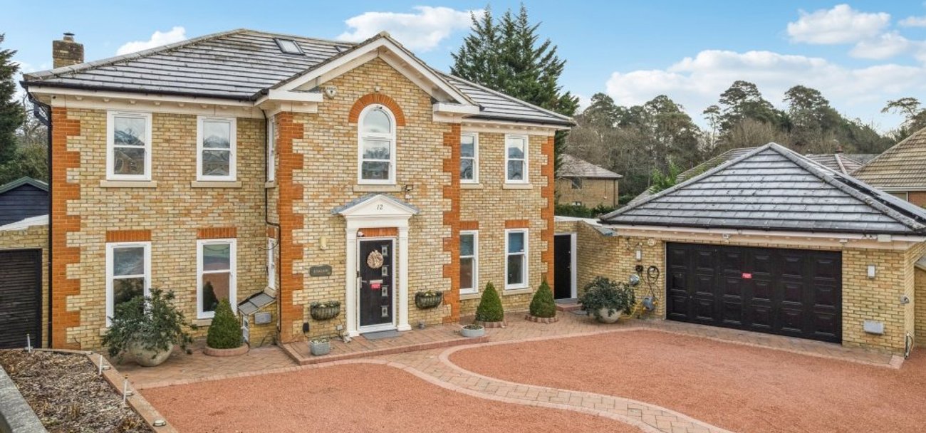 Elmwood Park detached family home with portico entrance and double garage