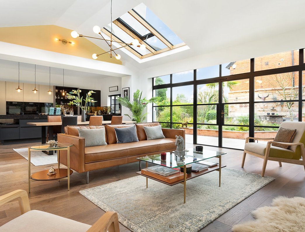 Open-plan living room extension with lantern rooflight and Crittall-style glazing